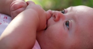 Parent removing Infant finger not letting baby suck finger