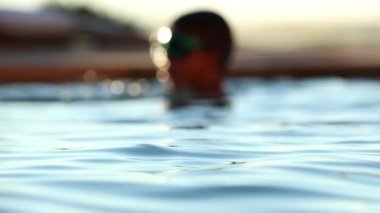 Swimming pool water surface in slow-motion