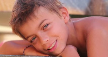 Beautiful child face smiling posing to camera