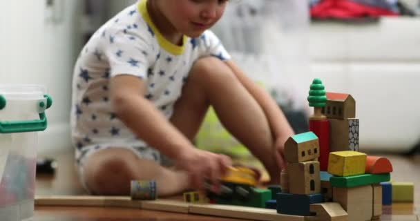 Little Boy Playing Wooden Toys Room — Vídeo de Stock