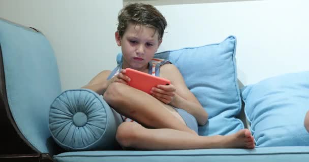 Child Holding Smartphone Playing Game Night — Video