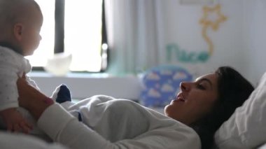 Candid mother and baby in room