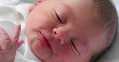Close-up of baby face in first day of life