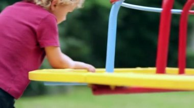 Boy playing at playground park outdoors