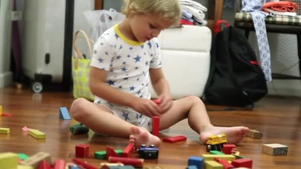 Child Playing Wooden Buildings Blocks Room — Stock videók