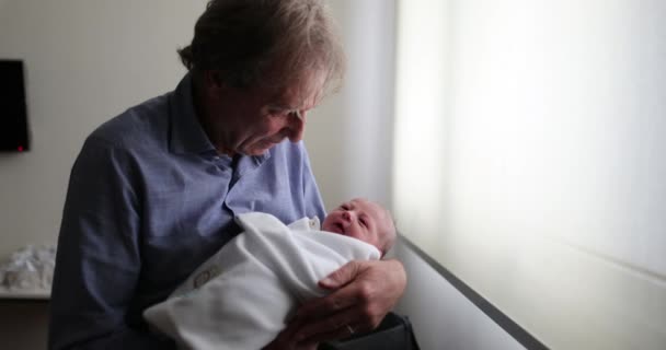 Grand Father Holding Newborn Baby Infant Arms Next Window First — 图库视频影像