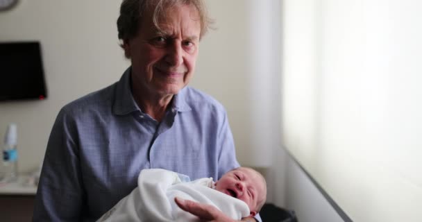 Grand Father Smiling Camera While Holding Newborn Baby — Stok video