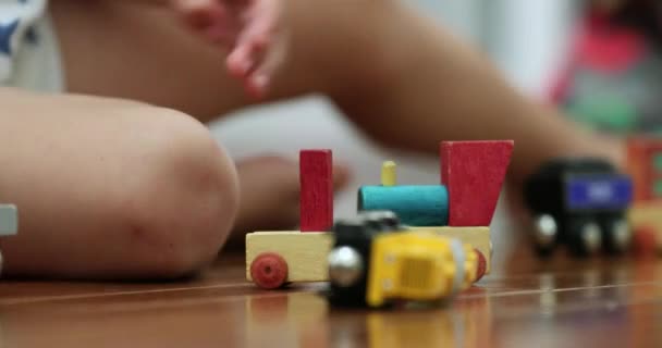 Little Kid Hands Playing Wooden Car Toys Making Automobile Crash — Vídeo de Stock