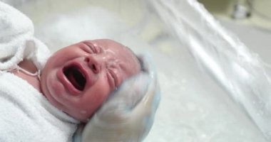 Newborn baby bath, washing cleaning infant head