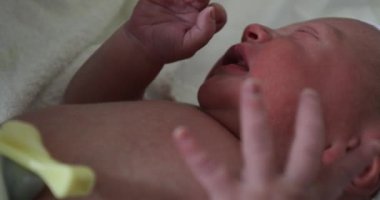 Newborn baby first minutes of life. Toddler in hospital