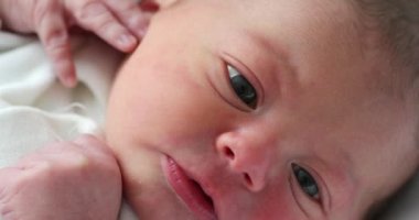 Infant newborn baby closeup face
