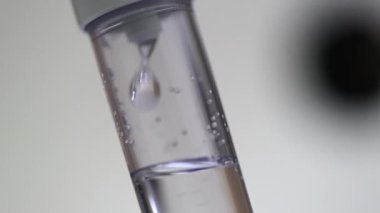 Close-up view of saline IV drip
