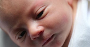 Macro close-up of newborn baby face during first week of life