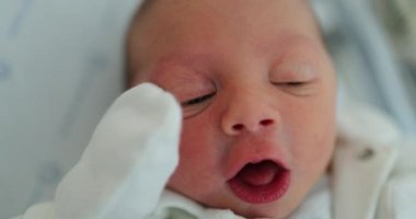 Baby newborn infant awake in first day of life
