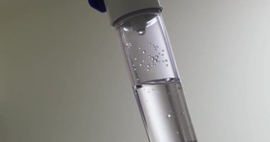 saline IV drip dropper at clinic