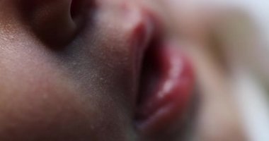 Closeup of infant newborn baby sleeping, first day of life