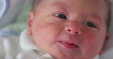 Newborn baby infant first moments of life observing and learning about the world