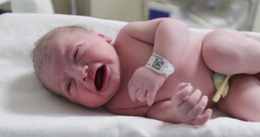 Newborn baby infant crying, first minutes of life of person