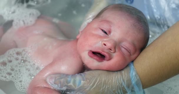 Newborn Baby Taking Bath Relaxing Eyes Closed Feeling Warm Water — 图库视频影像