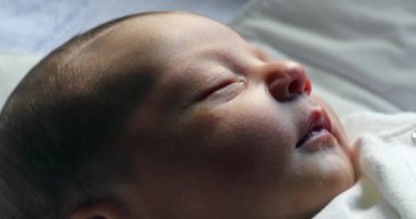 Newborn baby infant sleeping , first day of life