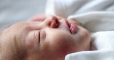 Newborn baby infant falling asleep during first day of life