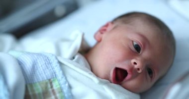 Newborn baby at hospital nursery after birth