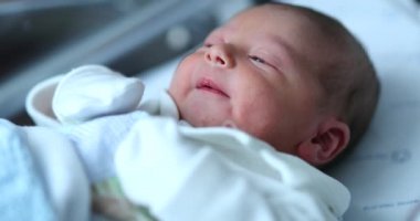 Newborn baby at hospital nursery after birth