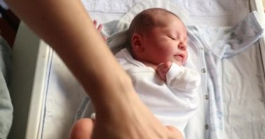 Curious Newborn baby infant first week of life observing world