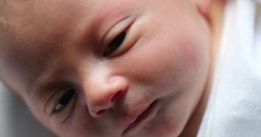 Macro close-up of newborn baby face during first week of life