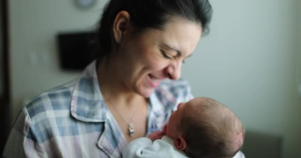 Mother Holding Newborn Baby Kissing Infant Showing Love Birth — Stock video