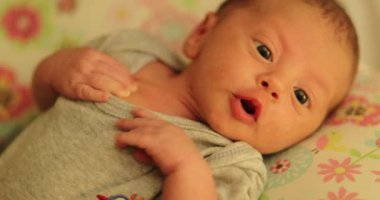 Newborn baby infant closeup face during first month of life