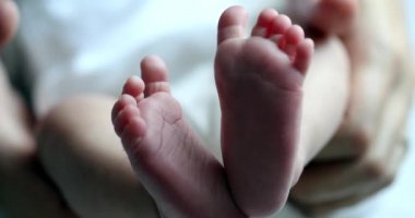 Baby newborn feet together, infant foot