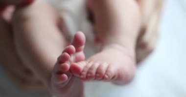 Baby newborn feet together, infant foot