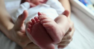 Baby newborn feet together, infant foot
