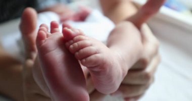 Baby newborn feet together, infant foot