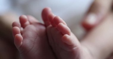 Baby newborn feet together, infant foot