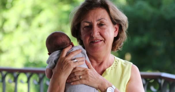 Portrait Grand Mother Holding Newborn Baby Grand Son Looking Camera — Video