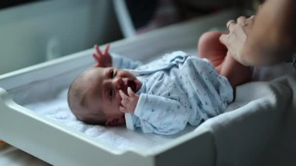 Newborn Baby Looking Camera While Mother Changes Diaper — Stock Video