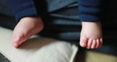 Closeup of cute adorable baby newborn feet