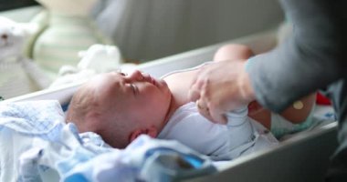 Mother clothing crying newborn baby infant