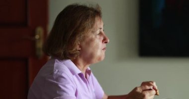 Older woman eating lunch candid authentic