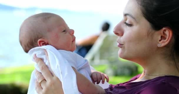 Mother Holding Kissing Caring Newborn Baby Infant Outdoors — ストック動画