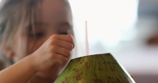 Little Girl Drinking Coconut Fruit Straw — 图库视频影像