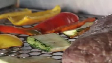 Vegetables and meat on grill cooking