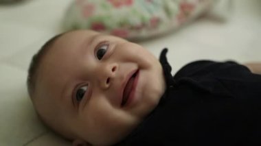 Baby laughing and smiling, joyful cheerful and happy baby laugh