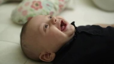 Baby laughing and smiling, joyful cheerful and happy baby laugh