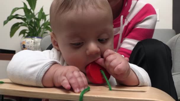 Cute Baby Playing Toys Putting Object Mouth — Vídeo de stock