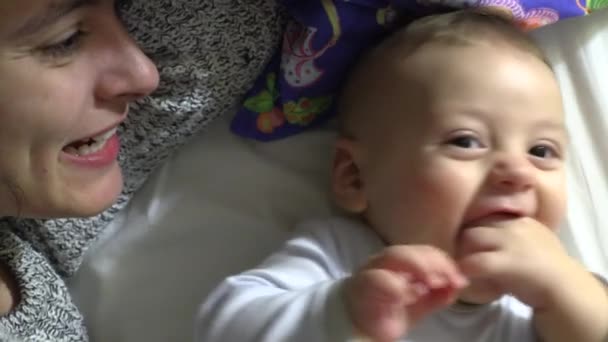 Mother Hugging Kissing Baby Son Bed Bonding Together — Wideo stockowe