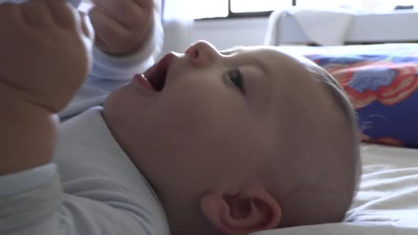 Adorable Cute Baby Infant Putting Feet Mouth — Stockvideo
