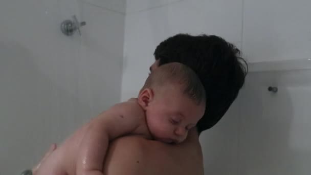 Father Holding Baby Son Shower Bathing Washing Month Old Baby — Stockvideo